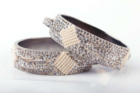 Indian Bangles. Bracelet with diamonds on a white backgroundの写真素材