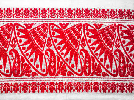 assamese gamosa ( gamusa , gamocha ) textile background ,gamusa pattern or gamosa border. gamosa is a traditional cloth of assam,north east.の写真素材