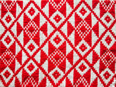 assamese gamosa ( gamusa , gamocha ) textile background ,gamusa pattern or gamosa border. gamosa is a traditional cloth of assam,north east.の写真素材
