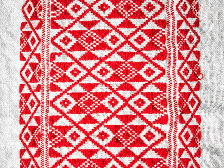 assamese gamosa ( gamusa , gamocha ) textile background ,gamusa pattern or gamosa border. gamosa is a traditional cloth of assam,north east.の写真素材
