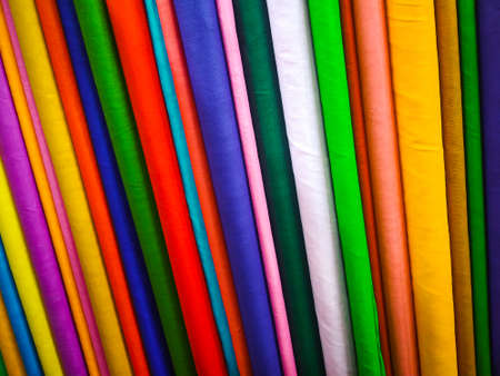 Rolls of colorful fabric as background, closeup. Textile industryの写真素材