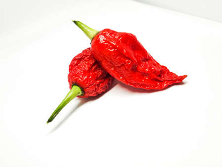 bhut jolokia ghost pepper isolated on white background. fresh Carolina Reaper.の写真素材