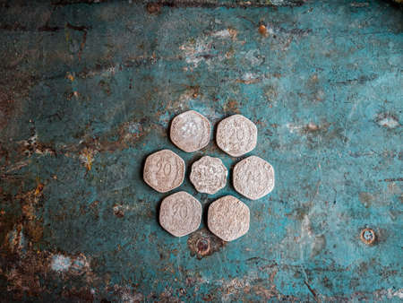 Ancient Roman coins on a blue rustic background. Top view.の写真素材