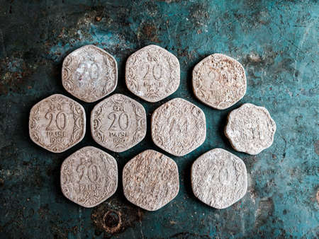 Ancient Roman coins on a rustic blue background. Top view.の写真素材