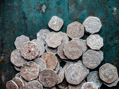 Ancient Jewish coins on rustic background. Top view. Copy space.の写真素材