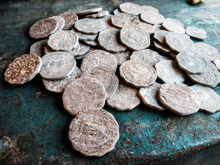 Ancient coins of the Roman Empire on a rustic background. Copy space.の写真素材