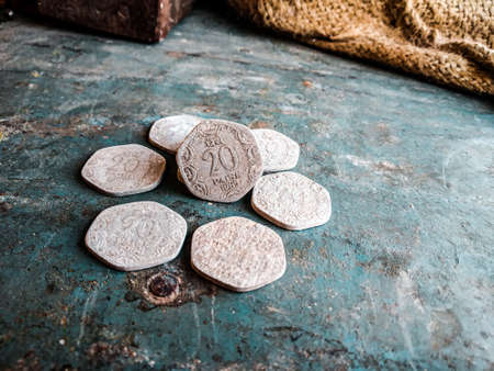 Ancient greek coins on rustic background. Top view with copy space