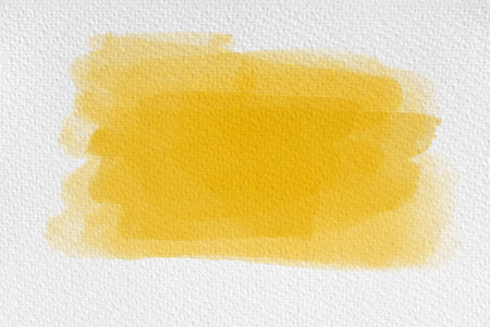 yellow watercolor on paper texture background. hand painted watercolor backgroundの写真素材