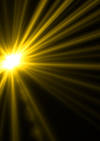 Sun with lens flare on a dark background. Yellow rays of light.の写真素材