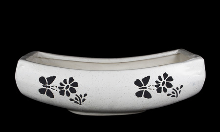 Boat Shape Ceramic Pot for Plant with butterfly and flower pattern on black backgroundの写真素材