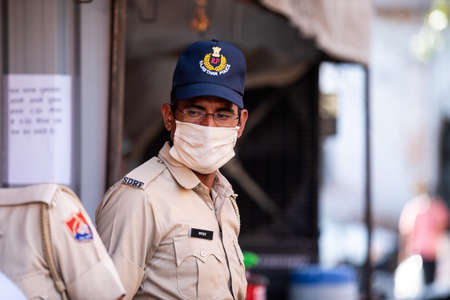 Jodhpur, Rajasthan, India - May 20 2020: Police and security wearing mask n the streets of covid-19 containment zone, hotspot during lockdown restricted area in india.のeditorial素材