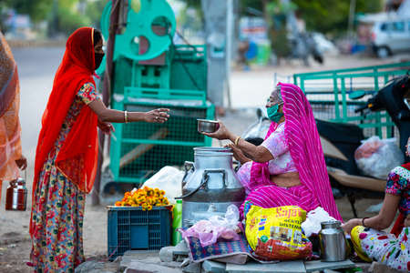 Jodhpur, Rajashtbn, India. 30 March 2020. people wearing protective mask buying food due to lock down, Coronavirus, COVID-19 outbreak in india.のeditorial素材