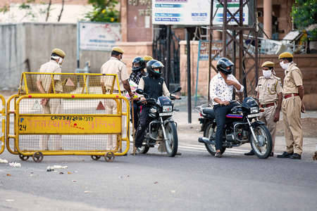 Jodhpur, Rajashtbn, India. 30 March 2020. Police stops citizen, commuters, entire country lockdown to prevent the spread of coronavirus. Local Police checks vehicle during COVID 19 pandemy. Stay Home.のeditorial素材