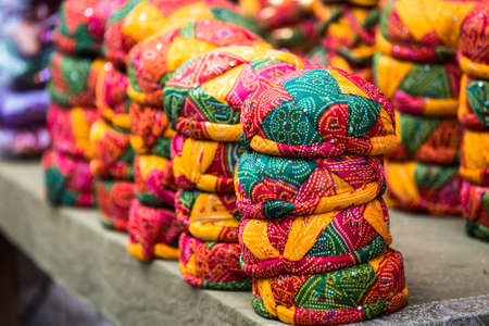 Stack of Colorful indian turbans. background Selective Focusの写真素材