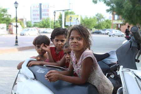 jodhpur, rajasthan, india, 20th September 2020: indian poor homeless little kids wearing dirty...