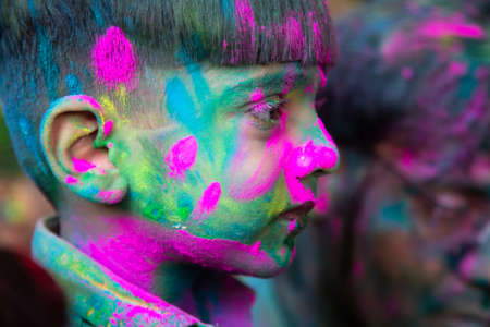 Jodhpur, rajastha, india - March 20, 2020: Portrait of cute little indian kid celebrating holi festival, closeup of face covered with colored powder.のeditorial素材