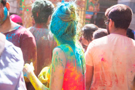 Jodhpur, rajastha, india - March 20, 2020: Young indian people celebrating holi festival, face and hair covered with colored powder. backgroundのeditorial素材