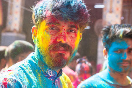 Jodhpur, rajastha, india - March 20, 2020: Young indian men face covered with colored powder, celebrating holi festival, closeup. looking at cameraのeditorial素材