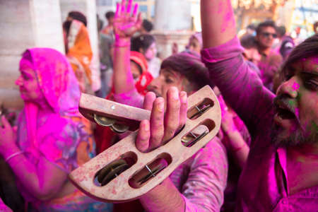 Jodhpur, rajastha, india - March 20, 2020: indian people dancing celebrating holi festival, face covered with colored powder.のeditorial素材