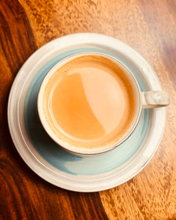 Hot and refreshing tea in a colorful ceramic cupの写真素材