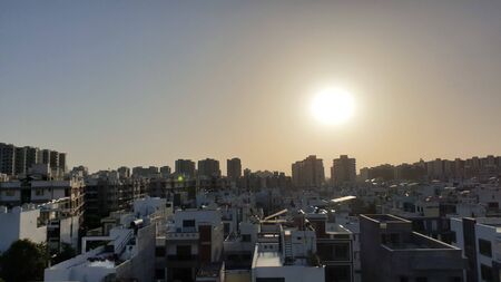 Sunset over the city. City during warm sunset. Best Sun Lights on city.の写真素材