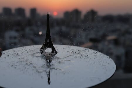 Eiffel Tower in Paris at sunrise & sunset. Small Eiffel Tower With Sun.