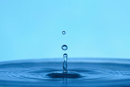 Water drop close up in blue