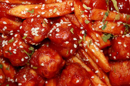 a very close up of honey chilli potato nuggets, view