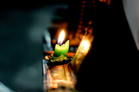 blurry bokeh background, flame in a diwali candleの写真素材