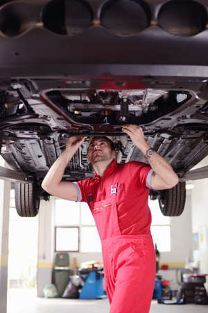 Man working in a garageの写真素材