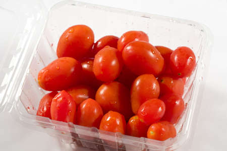 Red Cherry Tomatoes in a containerの写真素材