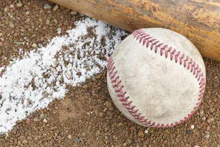 a baseball and a baseball batの写真素材
