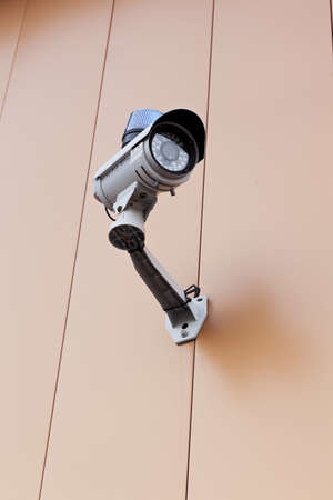A security camera on a wallの写真素材