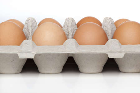 Brown eggs in an egg cartonの写真素材