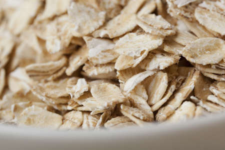 Dry Oatmeal in a bowlの写真素材