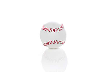 A clean white baseball against a white backgroundの写真素材