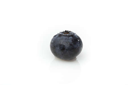 A fresh blueberry against a white backgroundの写真素材