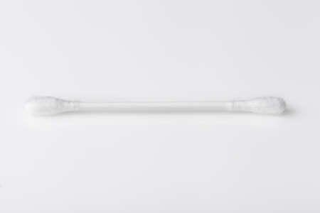 A cotton swab against a white backgroundの写真素材