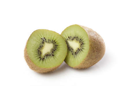 A fresh green kiwi against a white backgroundの写真素材