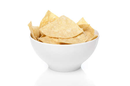 Fresh corn tortilla chips against a white backgroundの写真素材