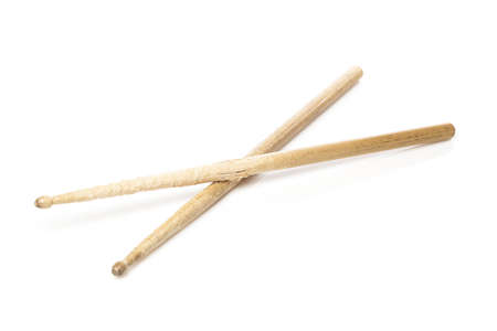 Wooden drum sticks against a white backgroundの写真素材