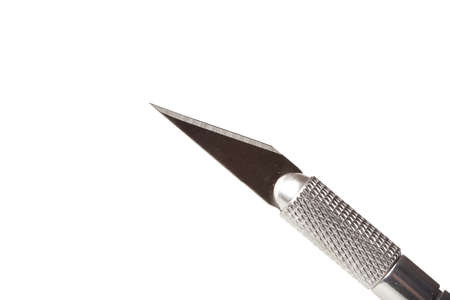 A shiny silver cutting utensil against a white backgroundの写真素材