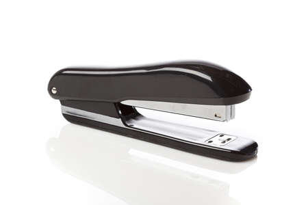 A black stapler against a white background