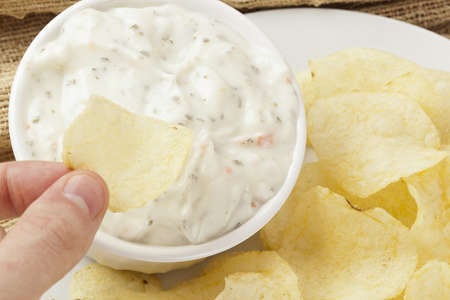 Fresh Potato Chips with Ranch Dip on a backgroundの写真素材