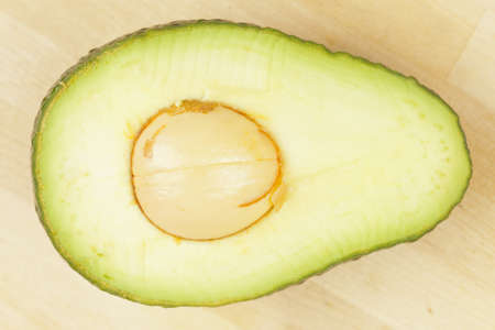 A fresh Organic Green Avocado on a background