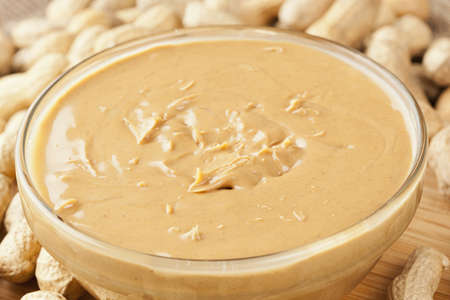 Creamy Brown Peanut Butter on a background