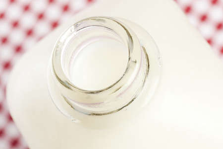 Tall Organic Glass of White Milk on a backgroundの写真素材