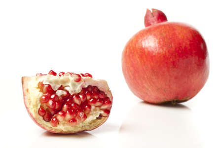Fresh Organic Red Pomegranate on a backgroundの写真素材
