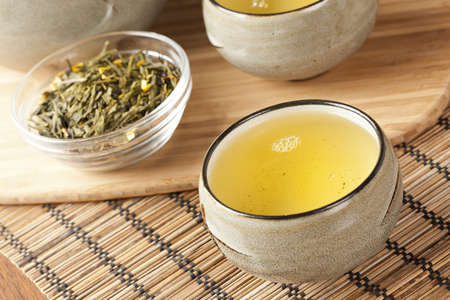 Organic Green Tea in a ceramic bowlの写真素材