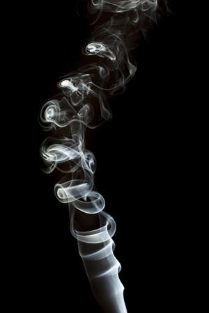 Whispy White Smoke against a black backgroundの写真素材